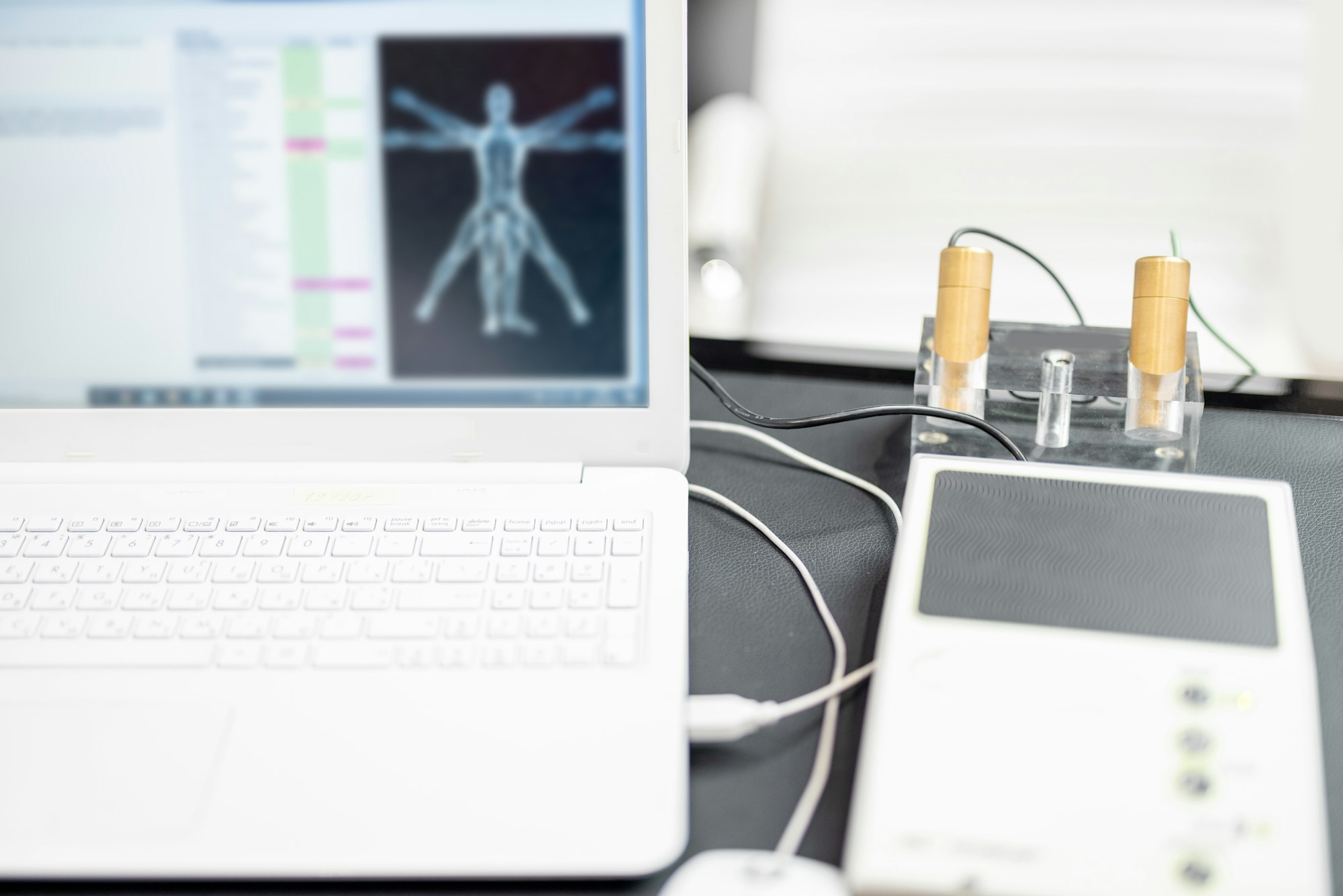 Bioenergetic testing device with brass handpieces in medical clinic